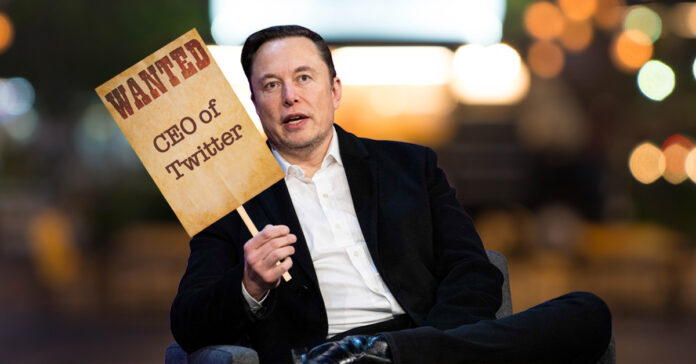 Elon Musk holding a waned sign